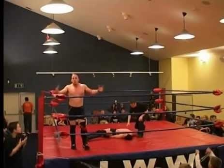 A picture of Gonzo de Mondo standing tall after winning in Irish Whip Wrestling (IWW).
